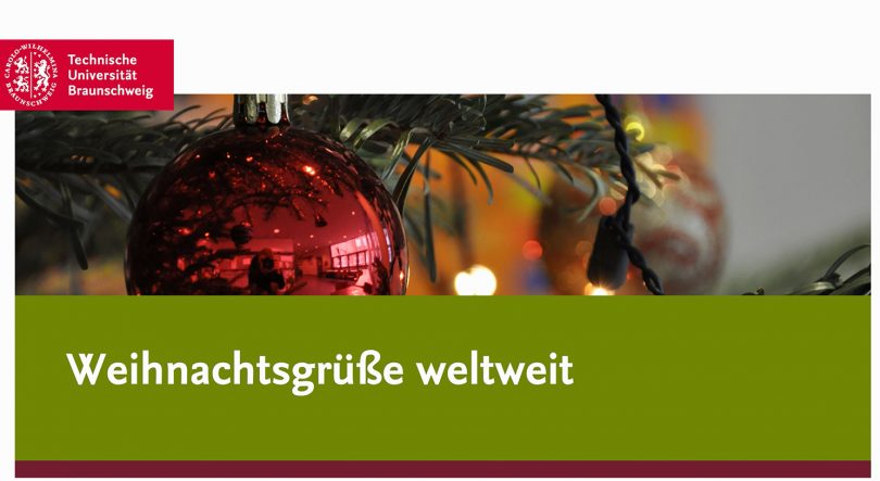 Zu sehen ist ein Foto mit einer Weihnachtsbaumkugel und dem Text Weihnachtsgrüße weltweit