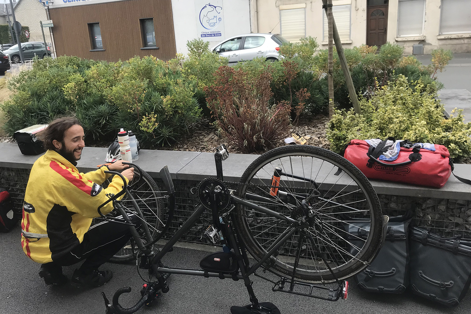 Moses Köhler repairs a flat tire on his bicycle.